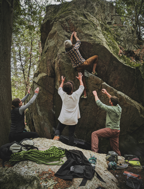 a group of people climbing together